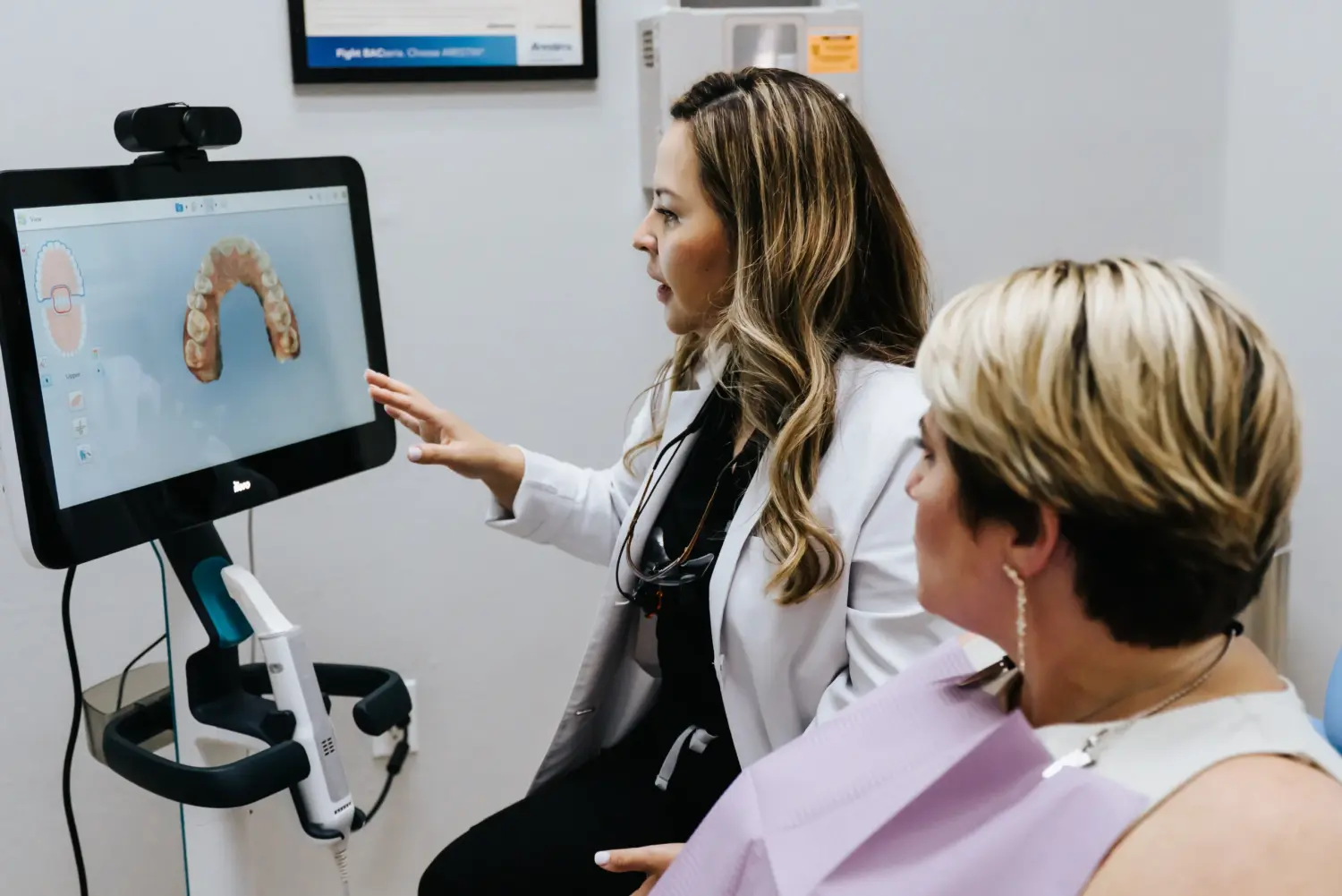 Dentist and patient looking at the monitor