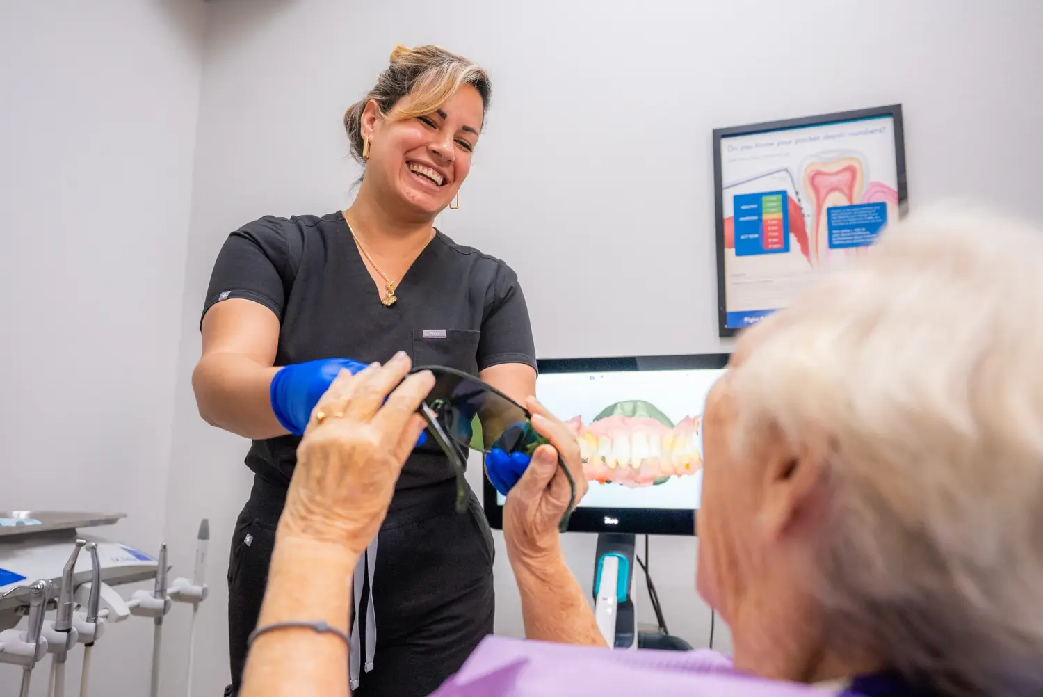 EZ Dental hygienist sharing a laugh with senior patient in Fort Myers, FL